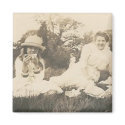 3 people at picnic eating magnet