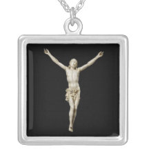 A 17th century carved ivory figure of Cristo Vivo Pendants