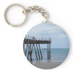 A Boy on a Bike at the Hervey Bay Ocean Pier. keychains