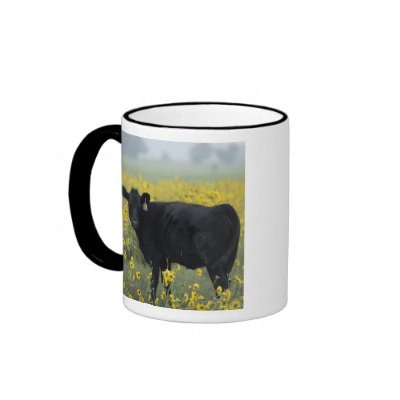 A calf amid the sunflowers of the Nebraska Coffee Mug by danitadelimont