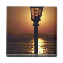 A candelabrum backed by a sunset, Aegean Sea, Turk Fridge Magnets