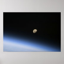 A gibbous moon visible above Earth's atmosphere Posters