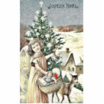 A girl standing with basket of gifts near christma photo sculptures