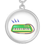 A green keytar with a blue strap graphic, custom necklace