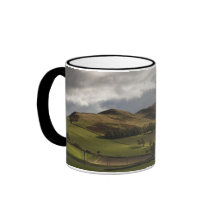 A Landscape With Rolling Hills And Clouds Overhead Coffee Mugs