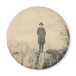A man on a cliff refrigerator magnet