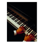 A man playing piano post cards
