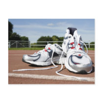 A pair of new white running trainers are placed postcards