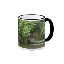 A Row Boat Roped At Some Stairs Along The Shore Coffee Mug