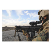 A soldier sights in to fire on a target