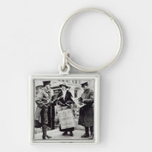 A Suffragette selling newspapers to two Keychains