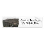 A surfboard sits on the beach in Florida on cliff Bumper Sticker