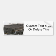 A surfboard sits on the beach in Florida on cliff Bumper Sticker