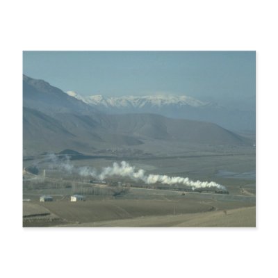 A Turkish 2-8-2 skirts the lake of the Keban Dam n Postcard by transports