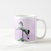 A white horse carousel statue against purple coffee mug