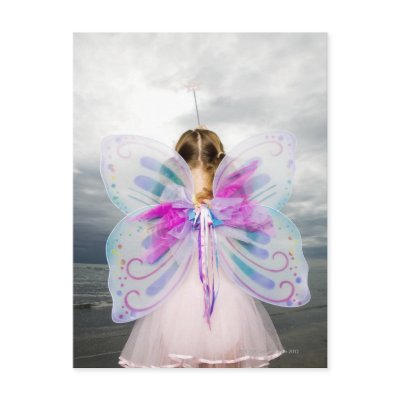 A young girl wearing a fairy costume postcard by prophoto