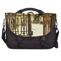 Abandoned wrought iron gate laptop commuter bag