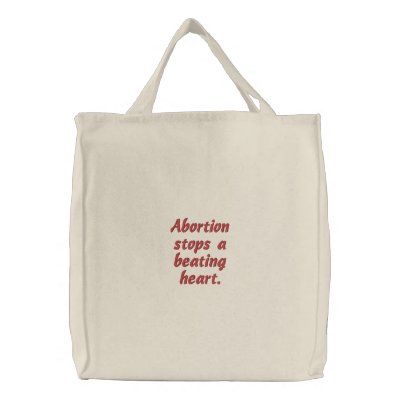 Abortion stops a beating heart. embroidered bag by stevenfeagler