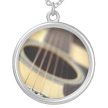 Acoustic guitar closeup photo jewelry
