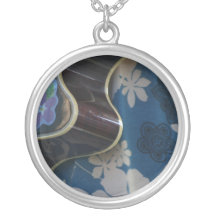 Acoustic Guitar Edge Against Blue Flower Dress Pendants
