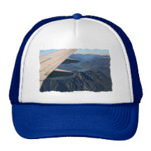 Aeroplane Flying Over the Rocky Mountains Trucker Hat