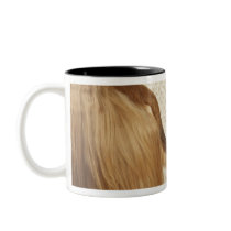Afghan hound standing in room, end section coffee mugs