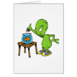 Alien feeding goldfish greeting card