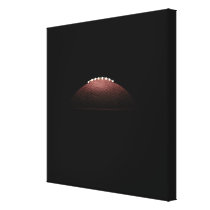 American football ball on black background canvas print