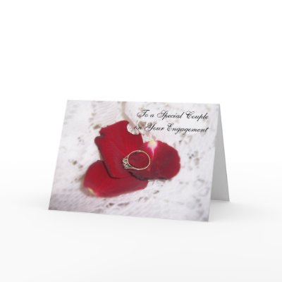 An Engagement Card Diamond Ring And Rose Petals by justbyjulie