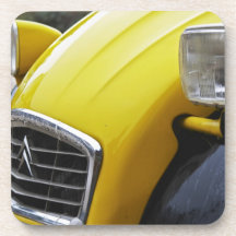 An old black and yellow Citroen 2CV 2 CV, detail Beverage Coasters