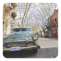 An old car rusty and flaky colour parked in the square sticker