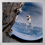 Astronaut conducting spacewalk above Discovery posters