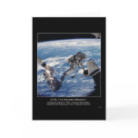 Astronaut David A. Wolf  transfers the Starboard O Card