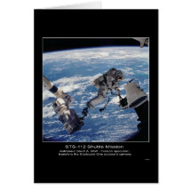 Astronaut David A. Wolf  transfers the Starboard O Card