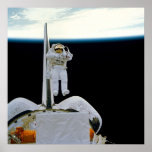 Astronaut Floating above Shuttle Discovery posters
