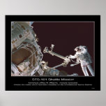 Astronaut Jeffrey N. Williams checks crane posters