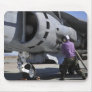 Aviation fuel technician attaches a fuel line mousepads