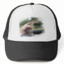Baby turkey chick being held by a hand trucker hat