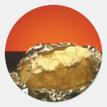 Baked potato with sour cream, against orange backg round stickers