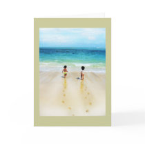 Beach babies in sand run to ocean greeting card