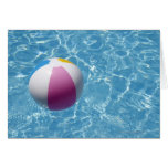 Beach ball in swimming pool greeting card