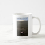 Beach litter plastic doll leg with sunrise mugs