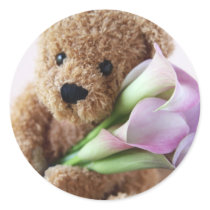 bear holding calla lilies round sticker