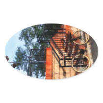 Bicycle by Train Station Oval Sticker