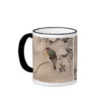 Bird perched on a branch of a blossoming tree mug