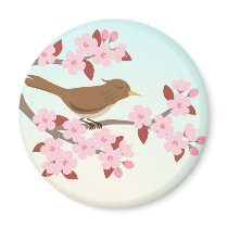 Bird sitting in a cherry blossom tree magnet