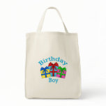 Birthday boy in blue with presents bag