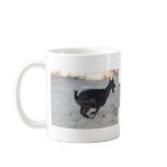 Black alpine goat doe running away to right mugs