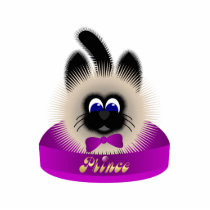 Black And Brown Cat With Dark Purple Tie In A Bed