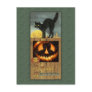 Black cat on a wooden fence with pumpkin postcards